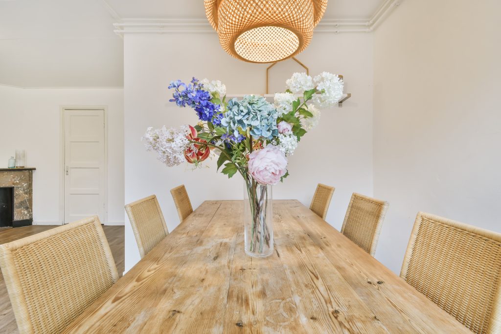 Dining room table with flower arrangement