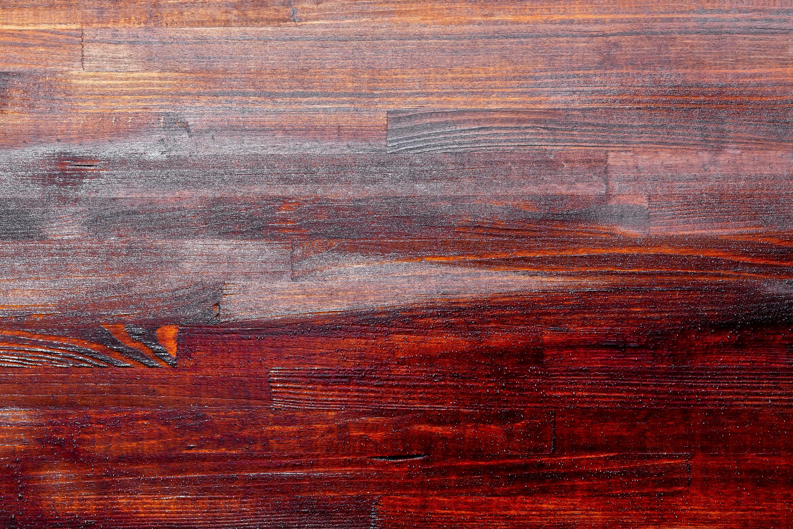Rich reddish-brown stain on a wood surface