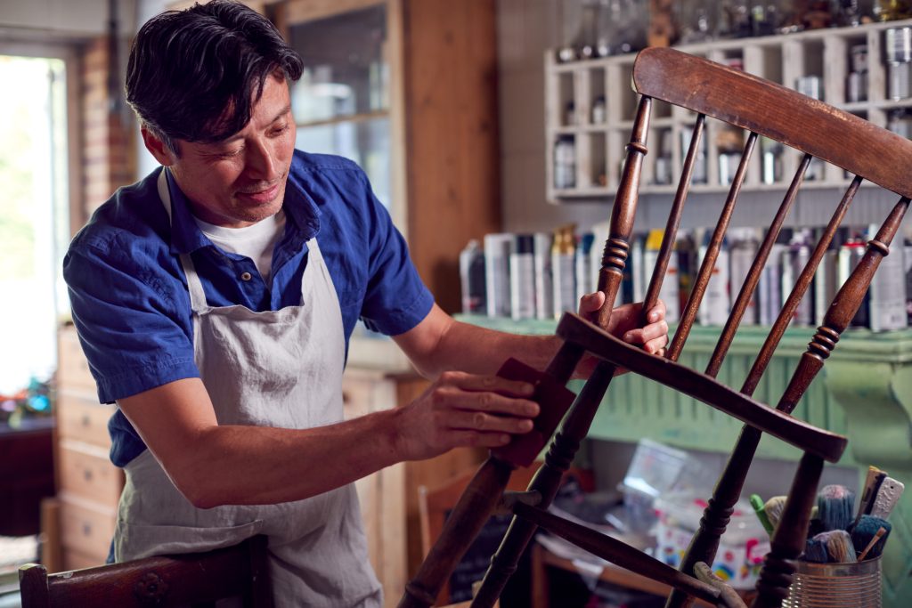 man fixing a chair