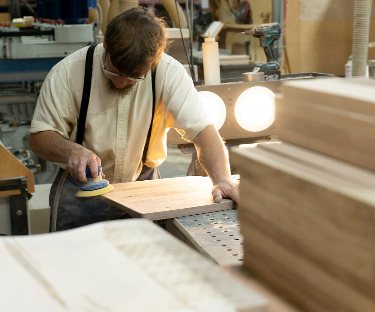 A solid wood desk displaying natural grain and a rich finish