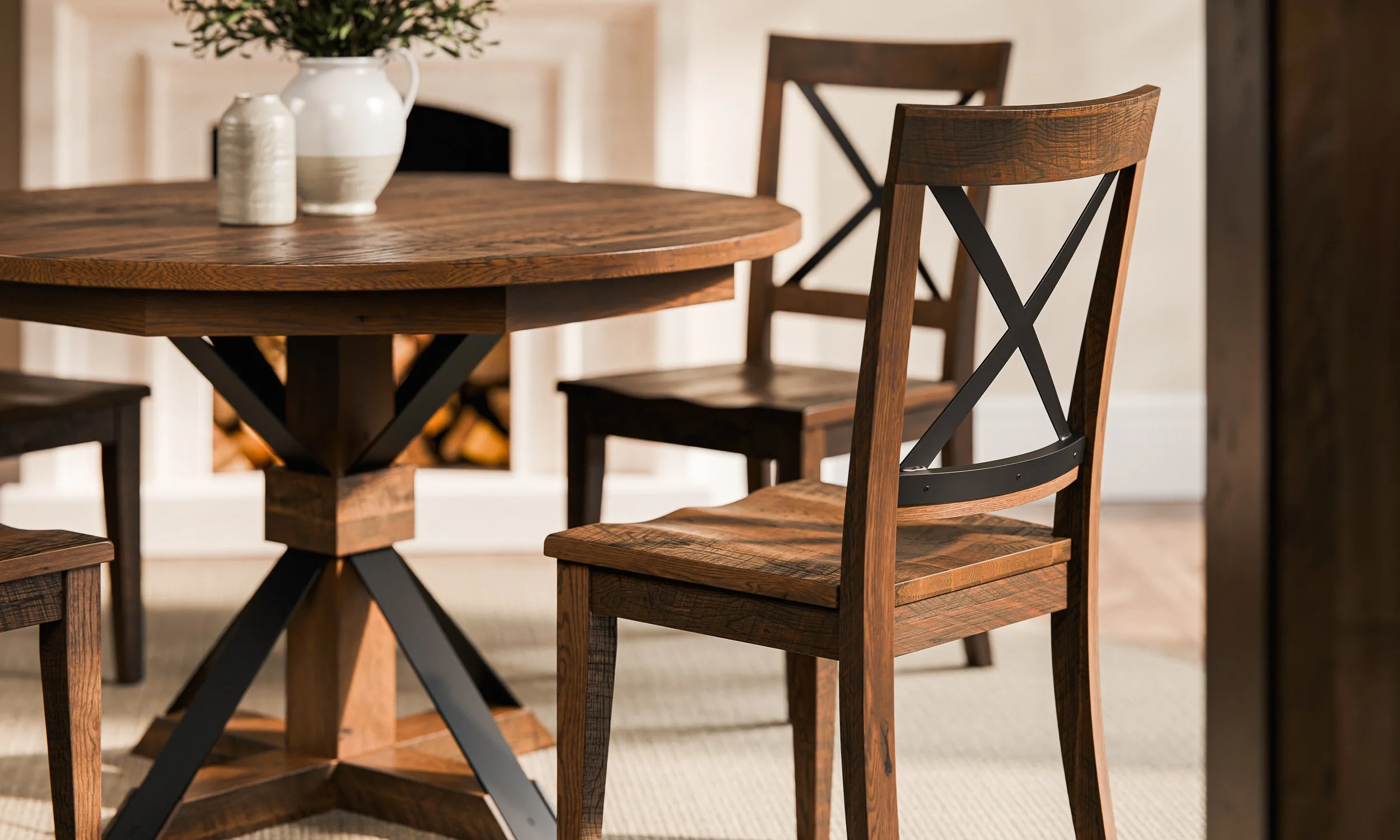 A solid wood barnwood dining table and chairs in a furnished dining room